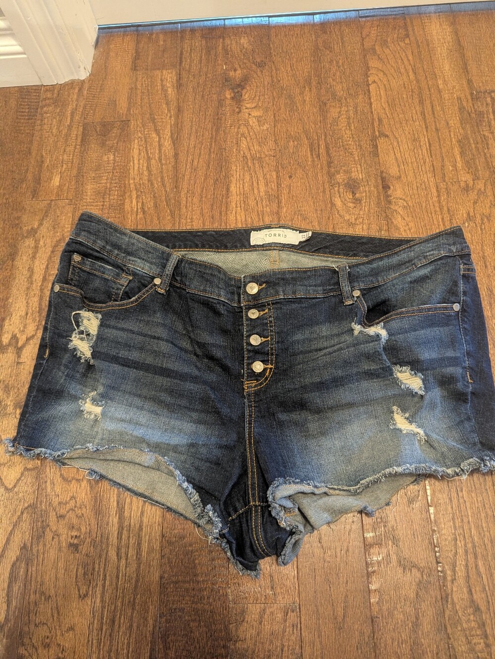 Torrid plus sized denim booty shorts button  fly distressed size 22. Like New